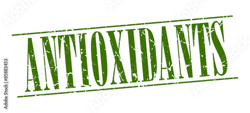 antioxidants green grunge vintage stamp isolated on white background
