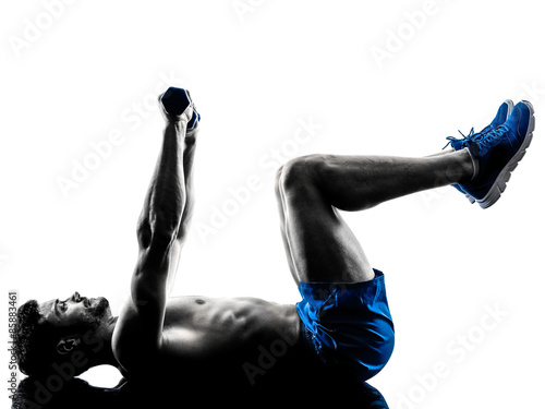 Fototapeta man exercising fitness crunches weights exercises silhouette