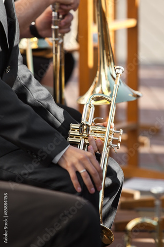 Trumpet in the hands of a musician 