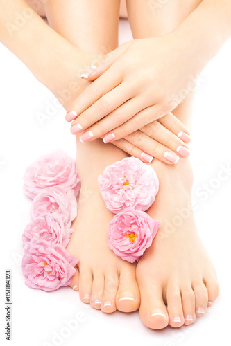 pedicure and manicure with a pink rose flower