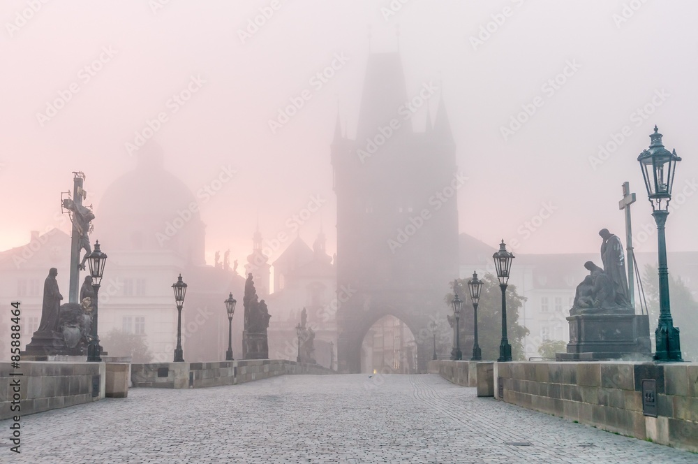 Charles Bridge in Prague at foggy morning