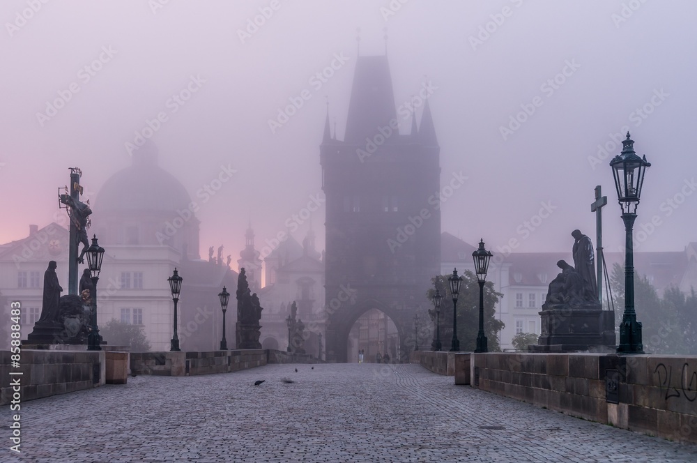 Charles Bridge in Prague at morning in fog