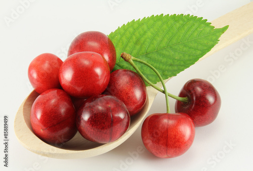 Abstract view cherry in a wooden spoon