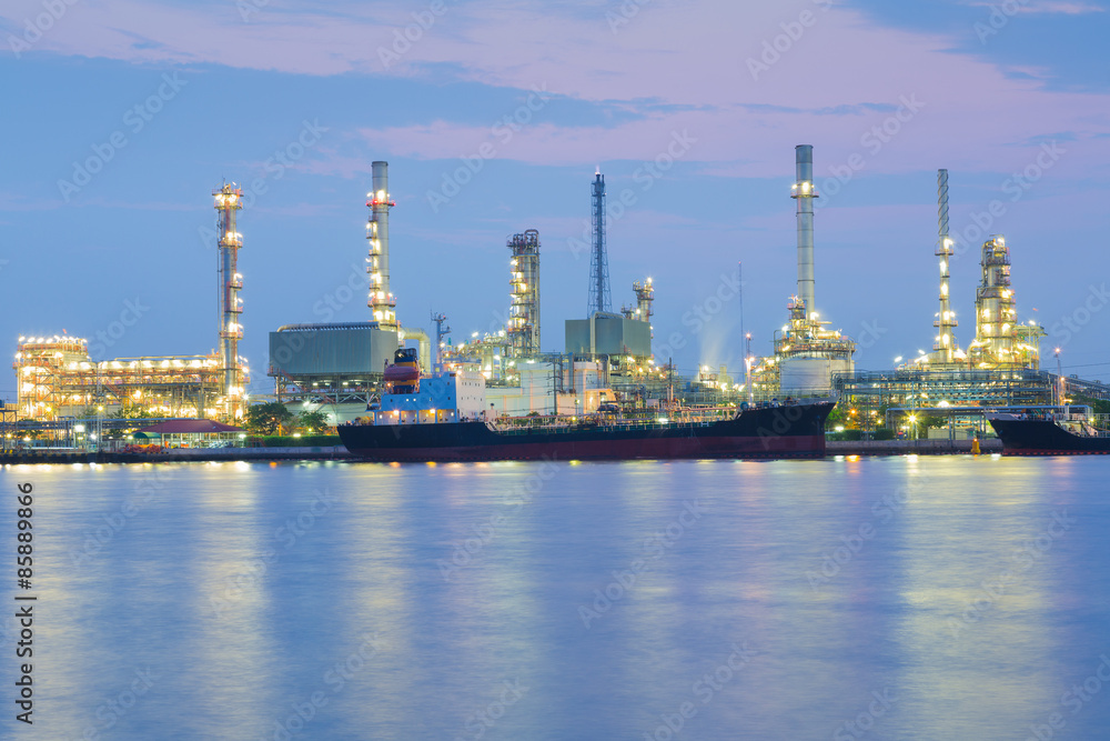 Oil refinery river front before sunrise Bangkok Thailand