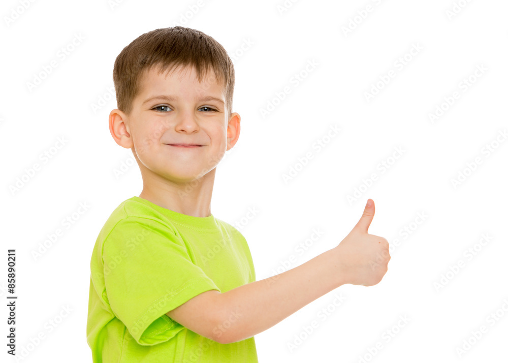 Boy smiling making the hand gesture moves or hitchhiking Boy smiling making the hand gesture moves or hitchhiking