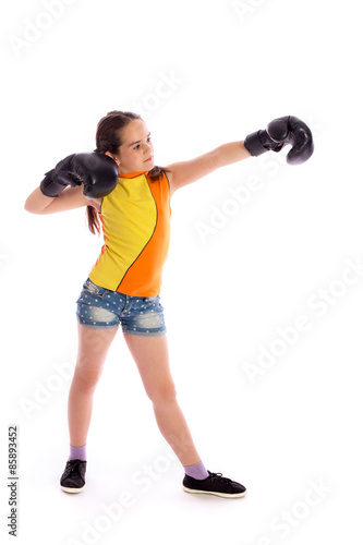 Young boxer girl on white studio background