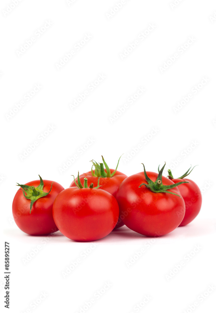 Fresh tomatoes with green leaves isolated on white background Fresh tomatoes with green leaves isolated on white background
