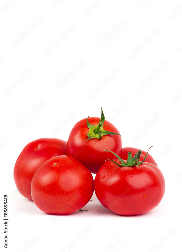 Fresh tomatoes with green leaves isolated on white background Fresh tomatoes with green leaves isolated on white background