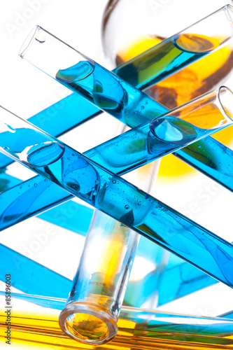 test tubes with colored liquid (yellow and blue) on a white  © fieryphoenix