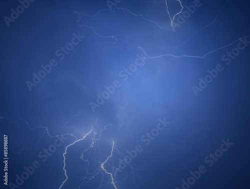 Strike of lightning in the night sky
