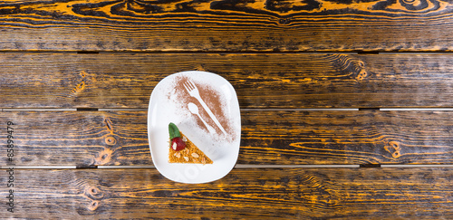 Slice of Cake Served on White Platter with Cocoa