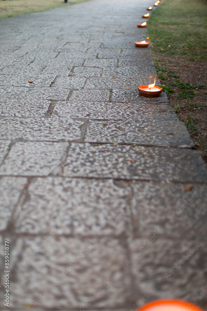 walkway decorated with candles