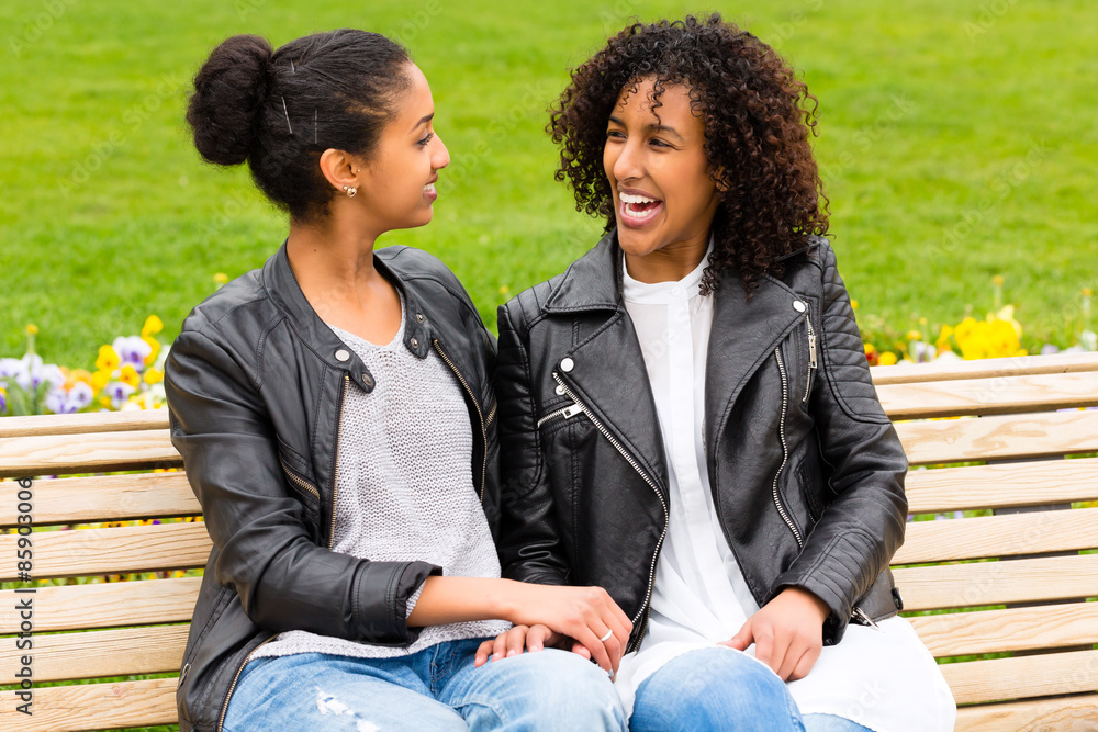 Best friends talking and having fun in park Best friends talking and having fun in park