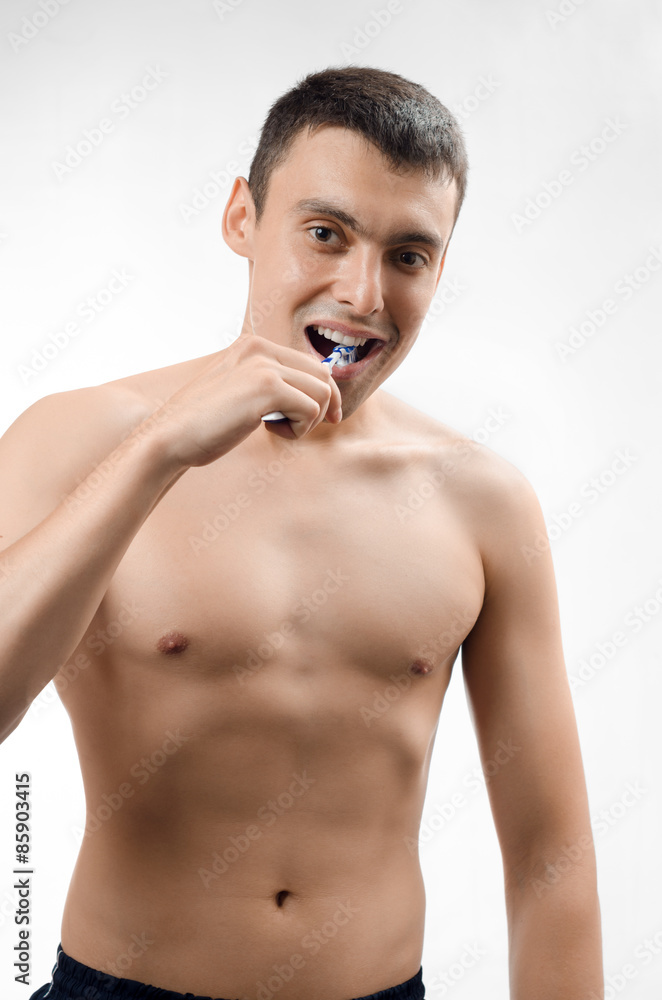Fototapeta premium man brushing his teeth