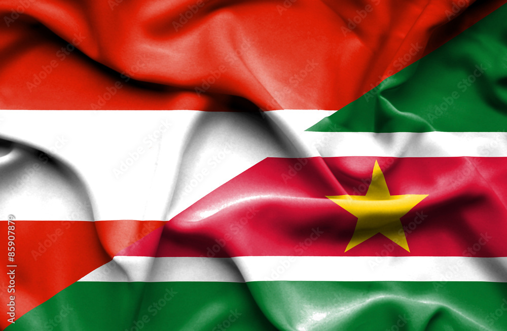 Waving flag of Suriname and Austria