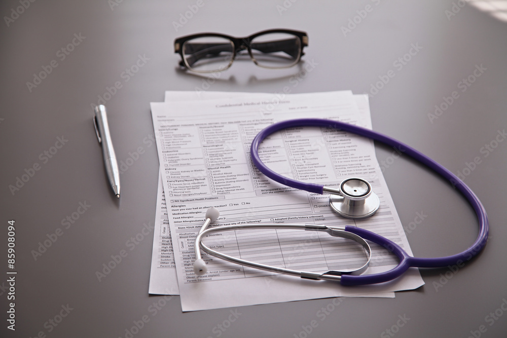 Stethoscope on the grey desk, close up Stethoscope on the grey desk, close up