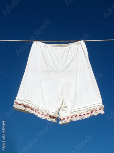 Foto Vintage women's underwear hanging on a clothesline