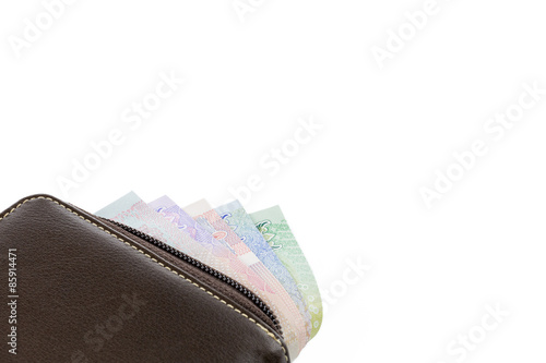 Wallet with money isolated on white background.