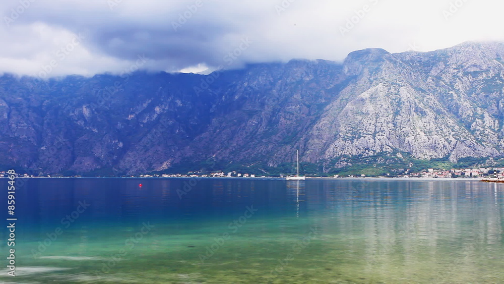 Gloomy weather around the beach on mountains background Gloomy weather around the beach on mountains background