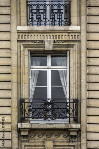 Traditional French house: balconies and windows. Paris, France.