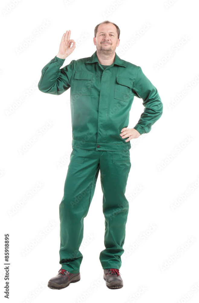 Worker in green with ok sign. Worker in green with ok sign.