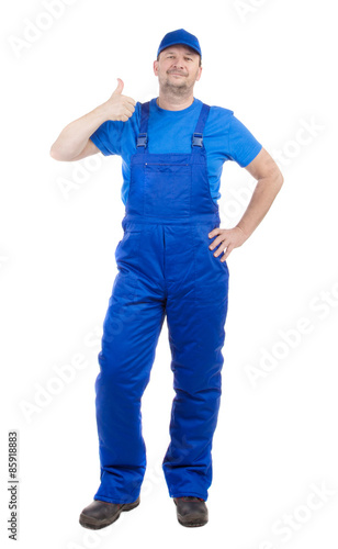 Man in blue overalls show ok sign.