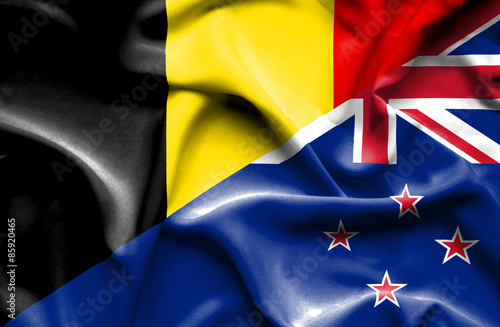 Waving flag of New Zealand and Belgium