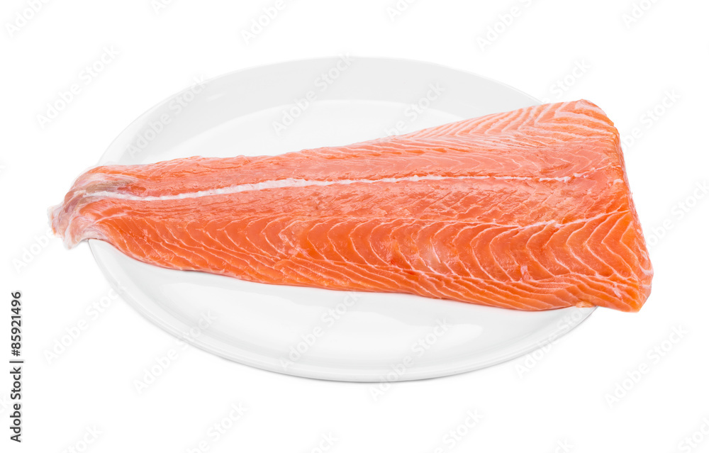 Raw salmon fillet on plate. Raw salmon fillet on plate.