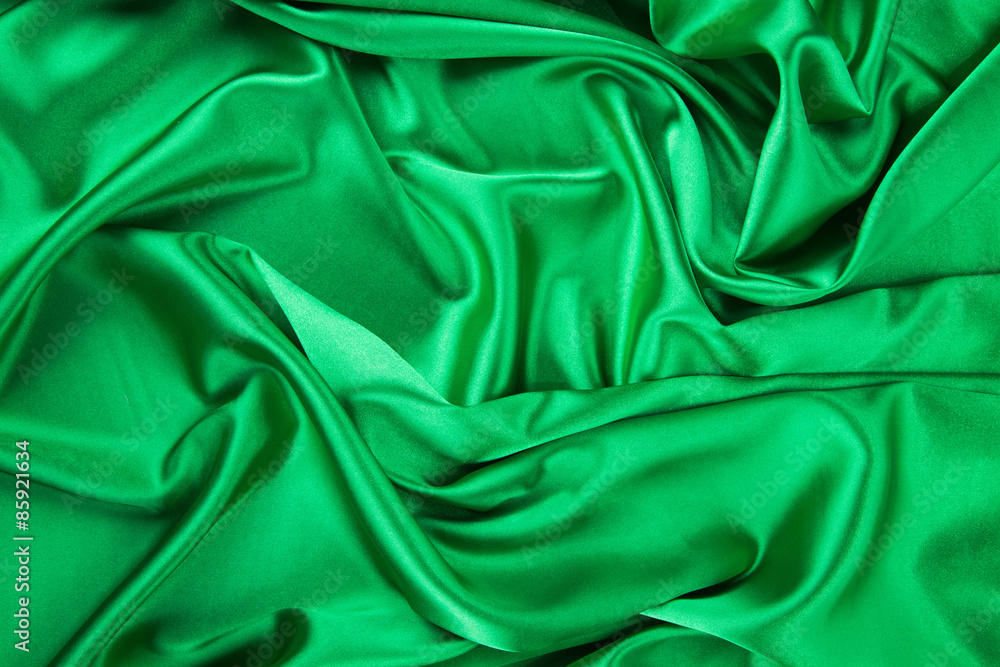 Fototapeta premium Green silk cloth with some folds.