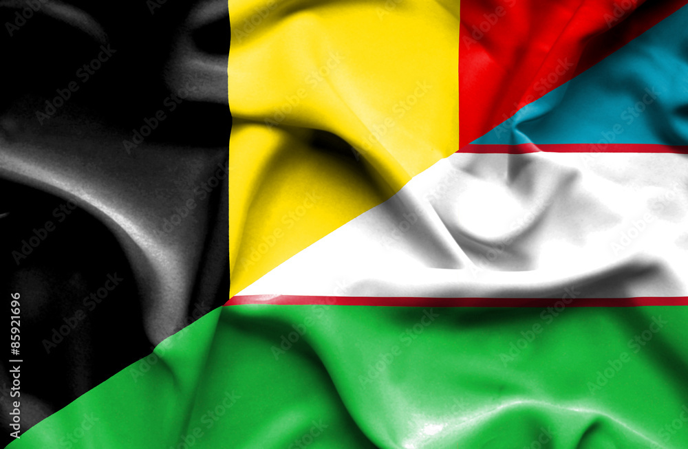 Obraz premium Waving flag of Uzbekistan and Belgium
