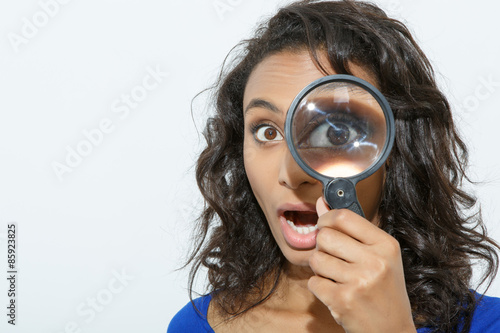 Funny girl with loupe