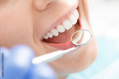 Fototapet Close-up of woman having her teeth examined