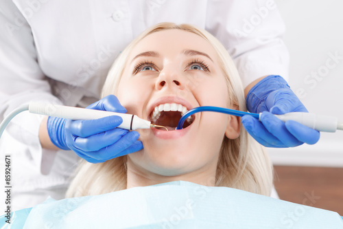 Pretty blond woman during her dentist visit 