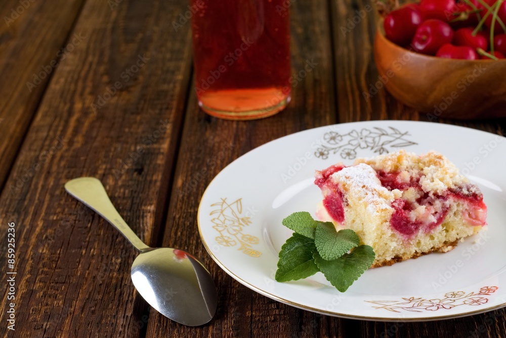 Fresh cherry pie on white plate with golden motif Fresh cherry pie on white plate with golden motif