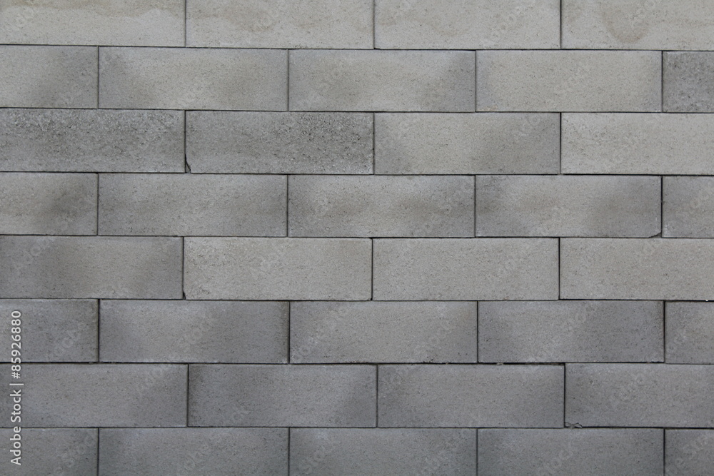 Naklejka premium Grauer Backsteinhintergrund
