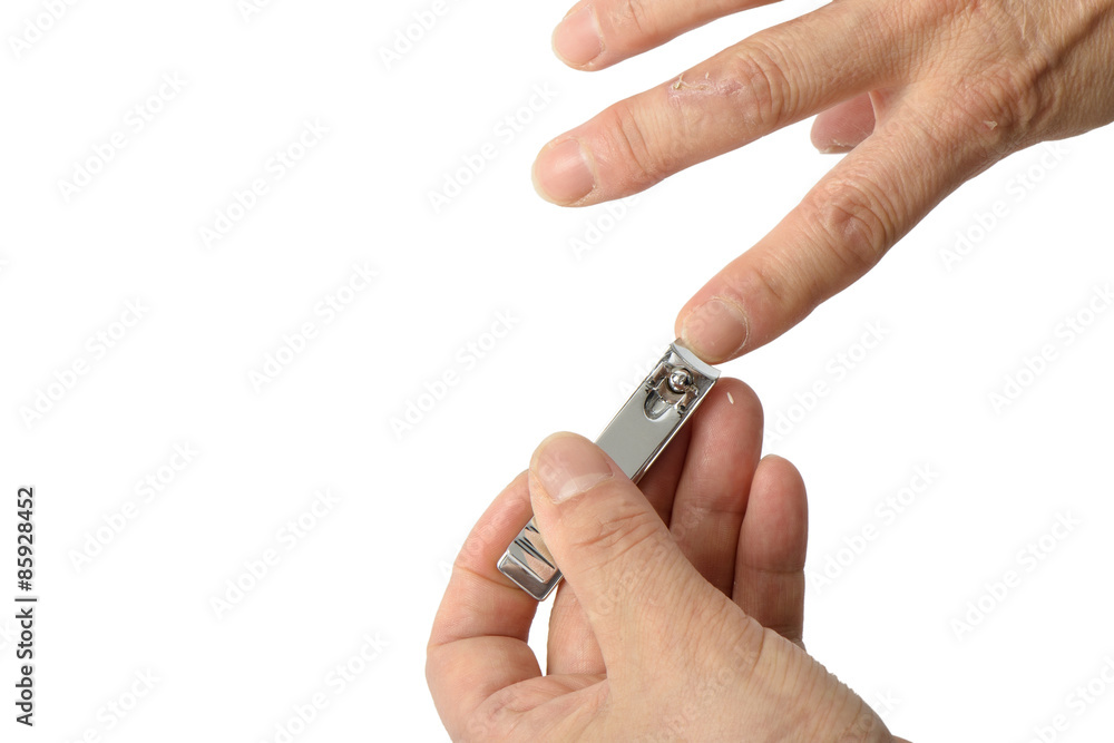old man's hand with nail clippings, isolated on white old man's hand with nail clippings, isolated on white