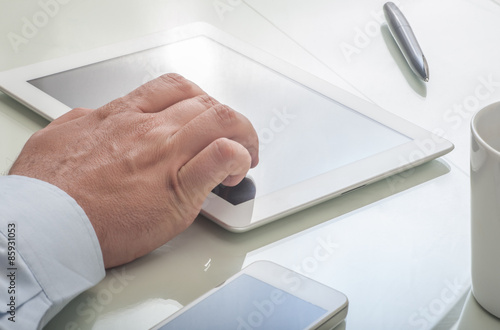 Businessman using tablet device