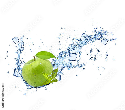 Green apple with water splashes on white