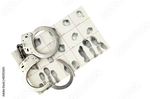 Handcuffs and fingerprint ID for arrest isolated on white.