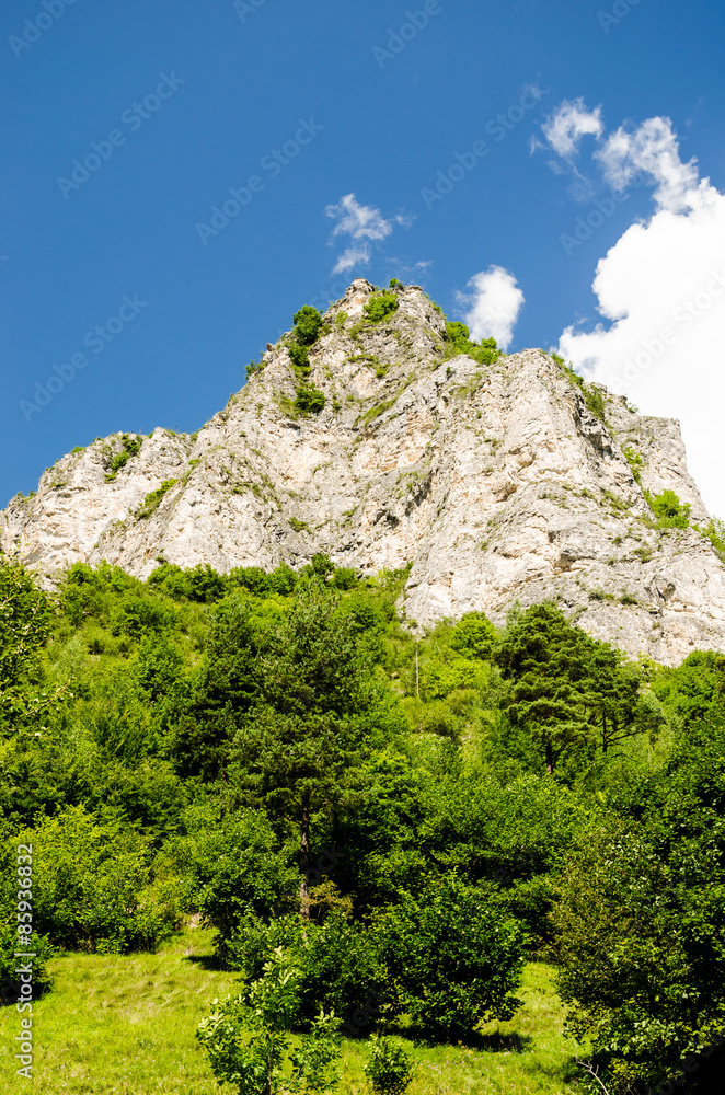 landscape of a bare mountain peak during summer on italian alps.