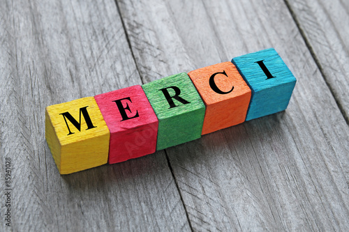 word merci (thank you in french) on colorful wooden cubes photo