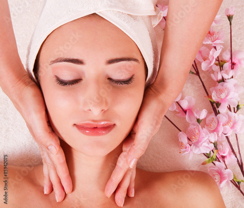 Beautiful young woman getting spa massage