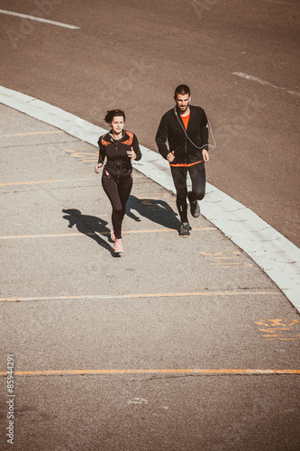 Couple running in an urban environment. Bird`s eye view