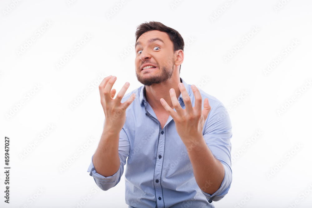 Emotional young guy is expressing negative feelings Emotional young guy is expressing negative feelings