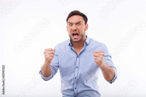Canvas Print Irritated young man is expressing his negative emotions
