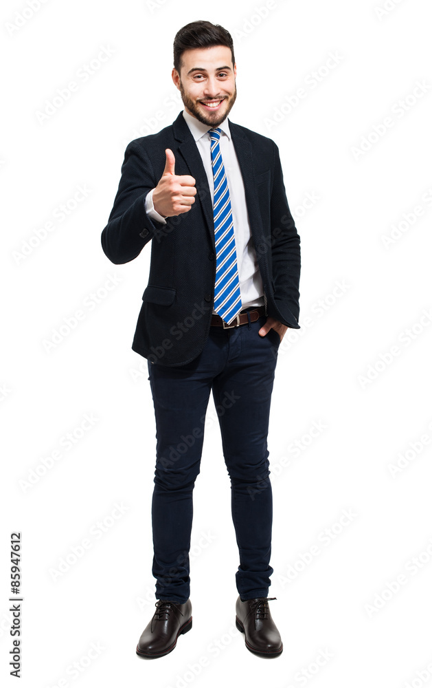 Young businessman isolated on white, full length and showing thumbs up Young businessman isolated on white, full length and showing thumbs up