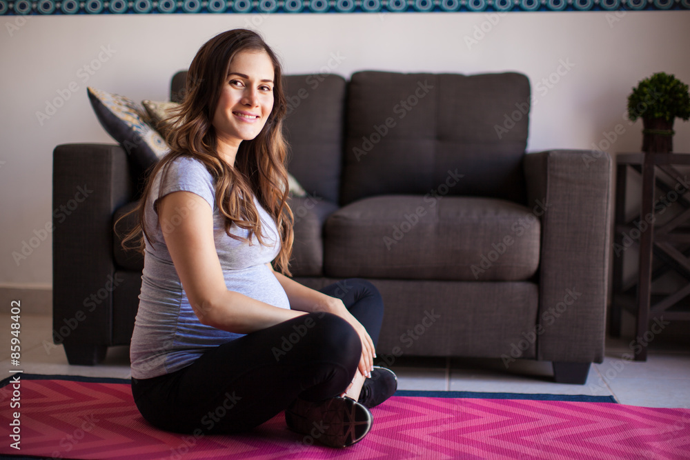 Pregnant mom exercising at home Pregnant mom exercising at home