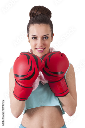 girl in gym wearing boxing gloves © carballo