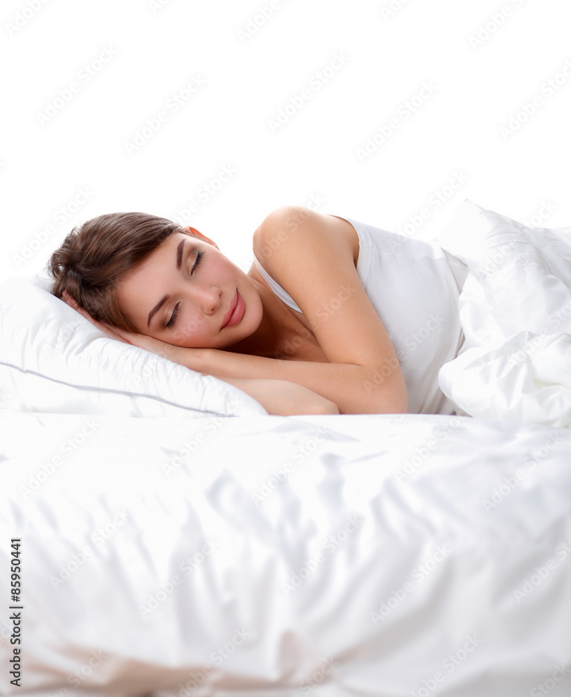 Beautiful girl sleeps in the bedroom, lying on bed Beautiful girl sleeps in the bedroom, lying on bed