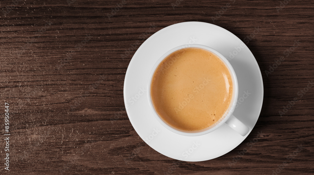 coffee cup and saucer top view on wooden background coffee cup and saucer top view on wooden background